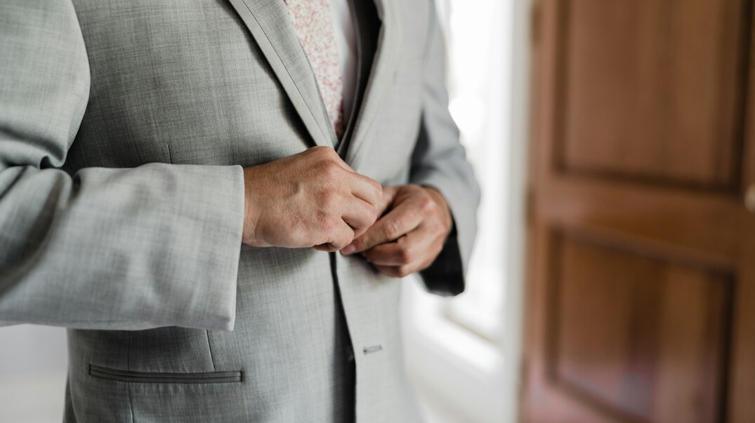 man hiding items in jacket