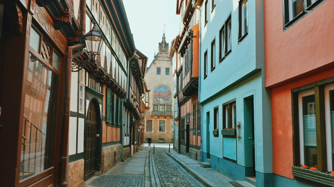 Historic European old town street with colorful tenement houses